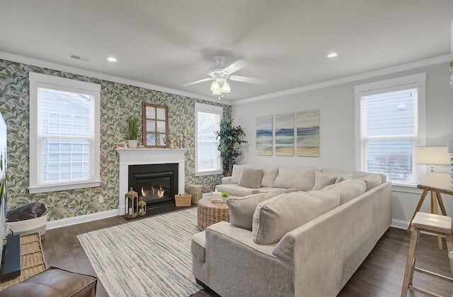 living room featuring dark wood-type flooring, baseboards, and wallpapered walls