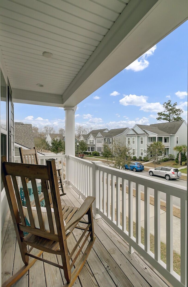 wooden deck with a residential view