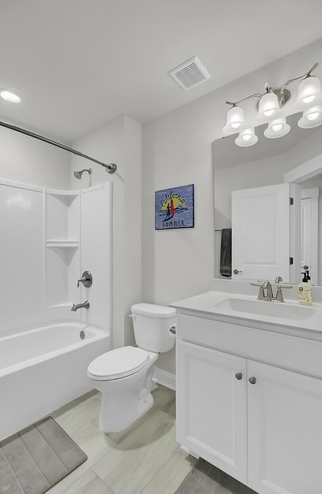 bathroom with toilet, shower / washtub combination, vanity, and visible vents