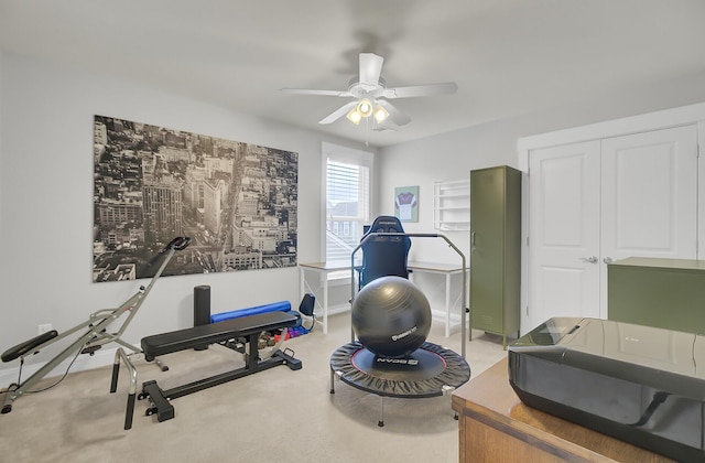 workout room with carpet floors, baseboards, and a ceiling fan