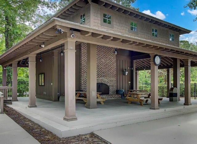 view of property's community with a patio area and fence