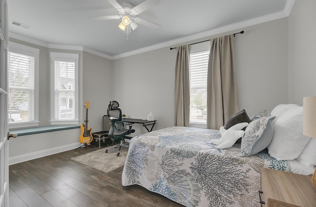 bedroom with dark wood-style floors, multiple windows, visible vents, and crown molding