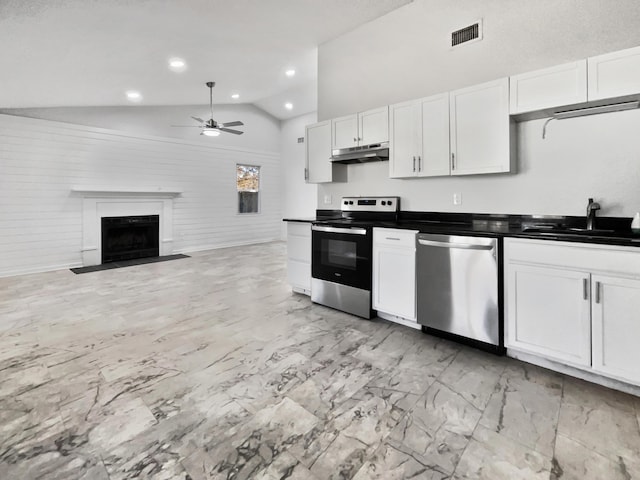 kitchen featuring white cabinetry, sink, ceiling fan, stainless steel appliances, and high vaulted ceiling