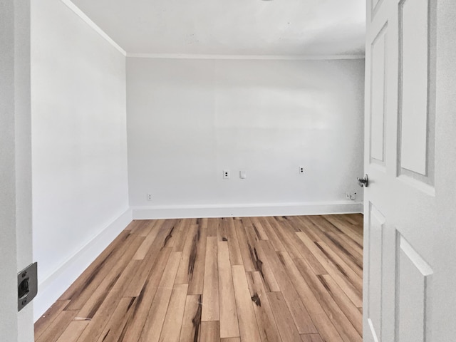 unfurnished room featuring crown molding and hardwood / wood-style flooring