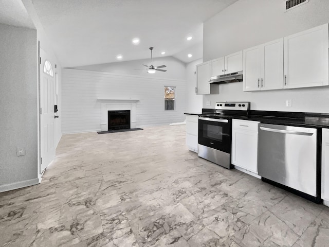 kitchen with white cabinetry, ceiling fan, vaulted ceiling, and appliances with stainless steel finishes