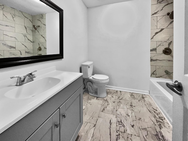 full bathroom featuring vanity, toilet, and tiled shower / bath