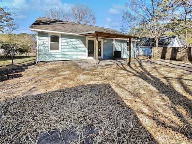 back of property featuring central AC and a patio