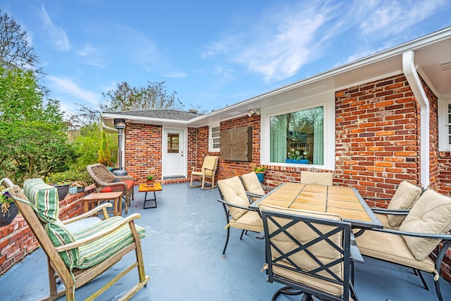 view of patio featuring outdoor dining space