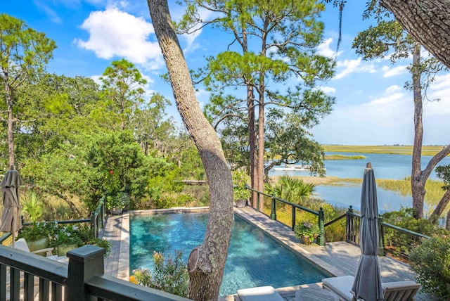 view of pool featuring a water view