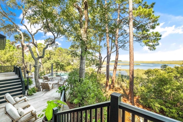 wooden terrace with a water view