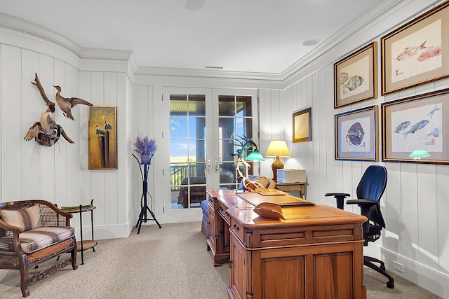 carpeted office space featuring french doors and ornamental molding