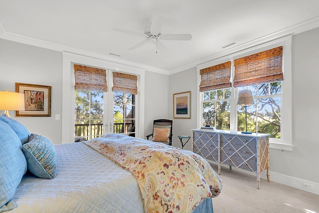 carpeted bedroom with crown molding, access to outside, ceiling fan, and french doors