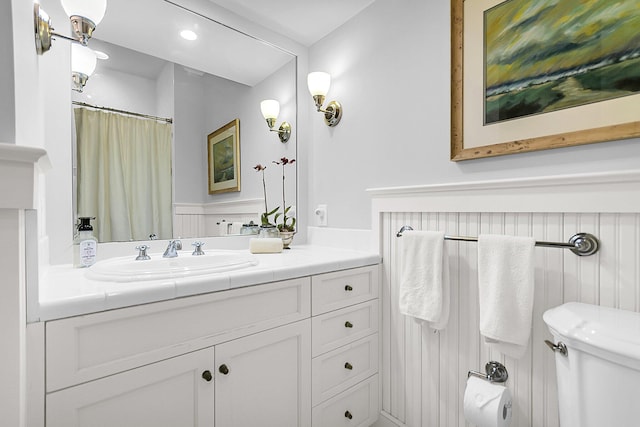 bathroom featuring vanity and toilet