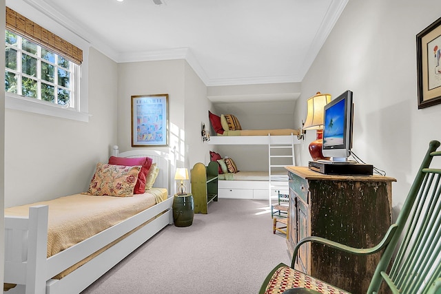 bedroom featuring ornamental molding and carpet floors