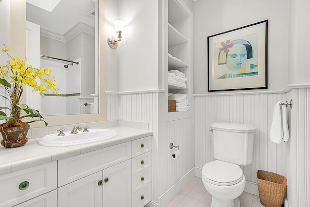 bathroom featuring tile patterned floors, vanity, and toilet