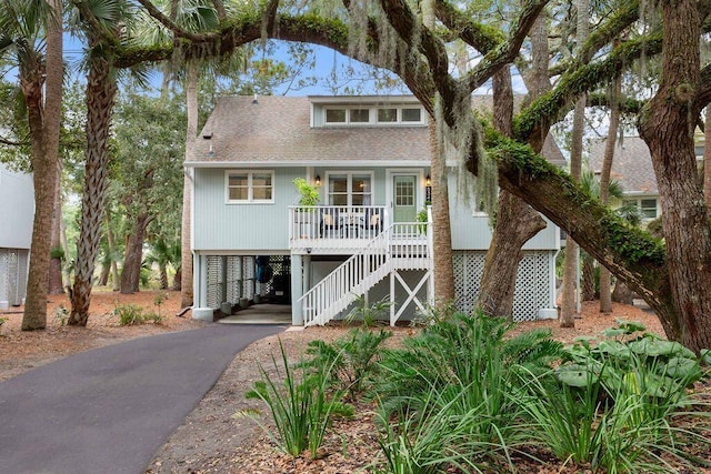 beach home featuring a carport and a porch