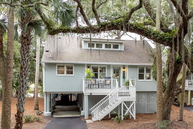 beach home with covered porch and a carport