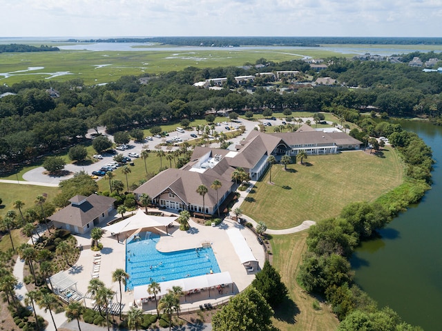 birds eye view of property with a water view