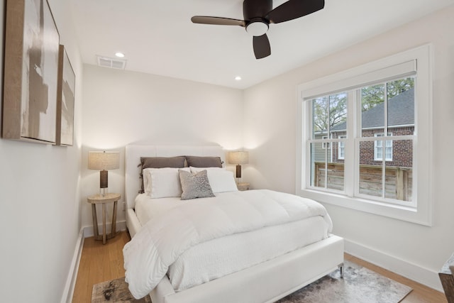 bedroom featuring recessed lighting, baseboards, light wood-style floors, and visible vents