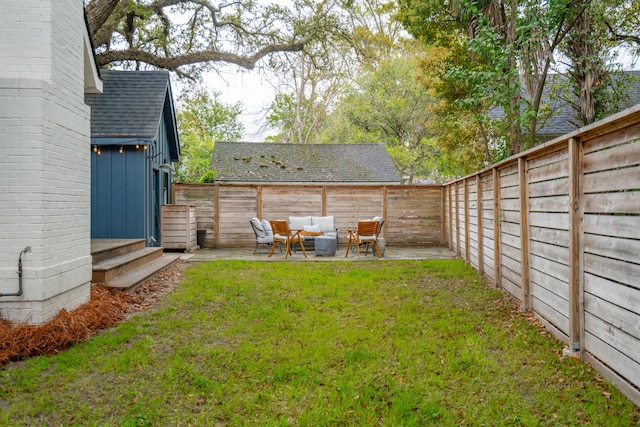 view of yard featuring a patio, an outdoor living space, and a fenced backyard