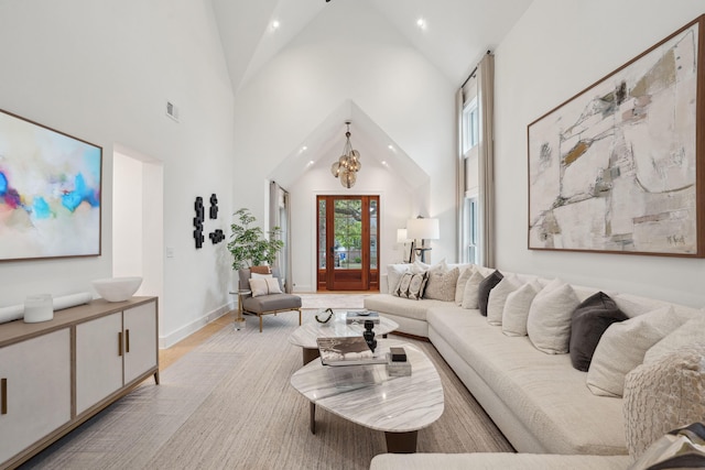 living area with baseboards, high vaulted ceiling, visible vents, and recessed lighting