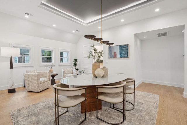 dining room with recessed lighting, baseboards, light wood finished floors, and visible vents