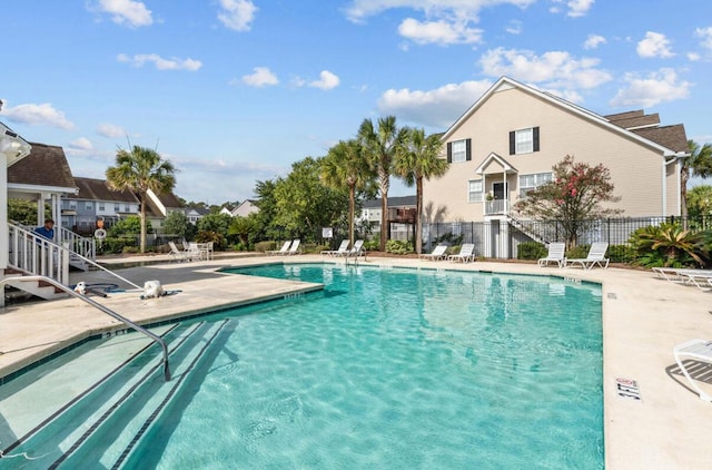 view of swimming pool with a patio area