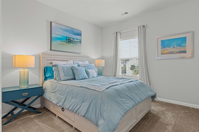 bedroom featuring light carpet