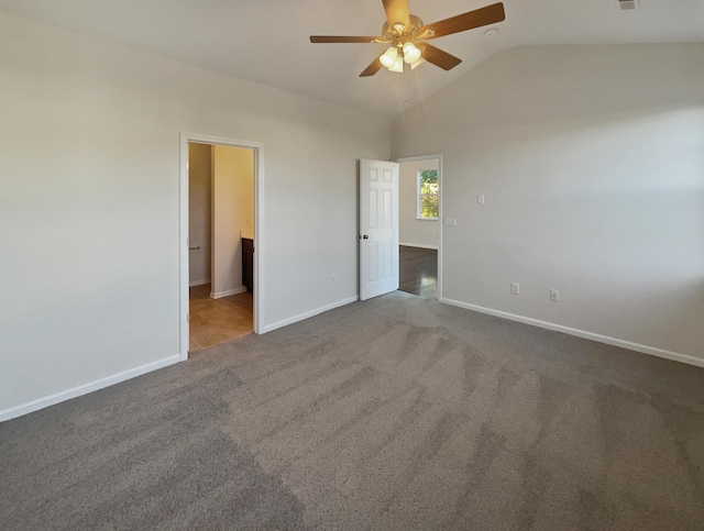136 Winding River Dr, Johns Island, SC 29455 - unfurnished bedroom featuring dark carpet, baseboards, vaulted ceiling, and ceiling fan