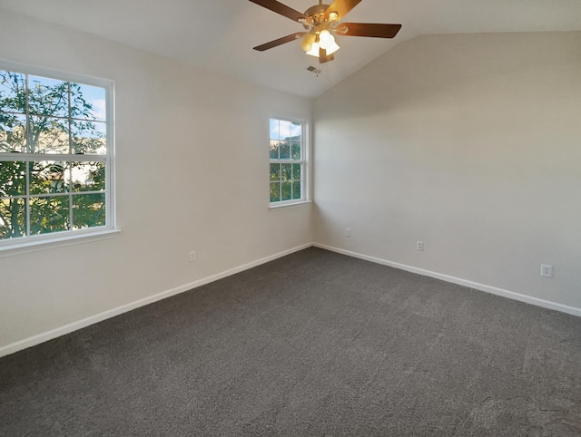 136 Winding River Dr, Johns Island, SC 29455 - empty room featuring lofted ceiling, healthy amount of natural light, a ceiling fan, baseboards, and dark carpet