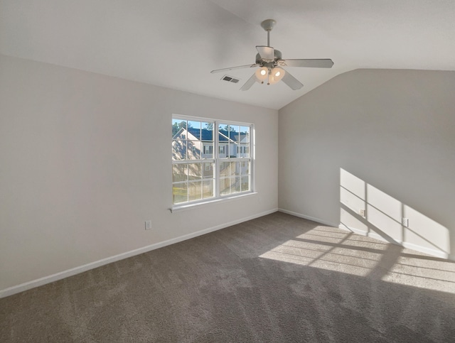 interior space featuring ceiling fan, light colored carpet, and lofted ceiling