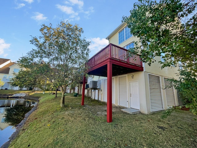 exterior space featuring a lawn and a wooden deck