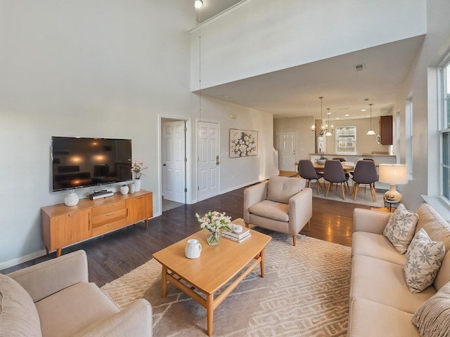 136 Winding River Dr, Johns Island, SC 29455 - living area with dark wood-style flooring, a chandelier, and a high ceiling