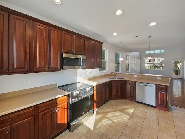136 Winding River Dr, Johns Island, SC 29455 - kitchen with stainless steel appliances, plenty of natural light, a sink, recessed lighting, and light countertops