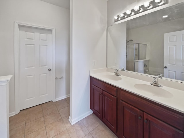 136 Winding River Dr, Johns Island, SC 29455 - full bathroom with a shower with shower door, double vanity, tile patterned floors, and baseboards