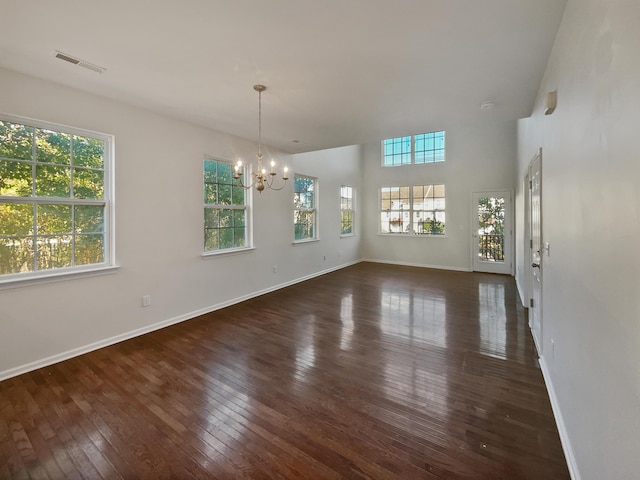 136 Winding River Dr, Johns Island, SC 29455 - unfurnished dining area featuring healthy amount of natural light, a chandelier, dark wood finished floors, baseboards, and a towering ceiling