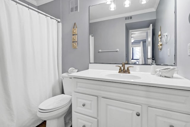 bathroom with toilet, ornamental molding, and vanity