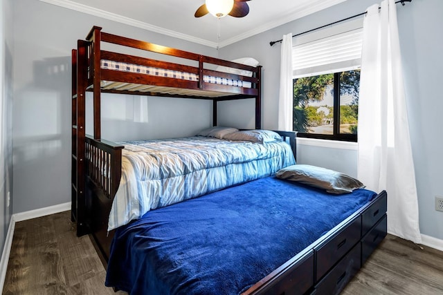 bedroom featuring ceiling fan, dark wood-type flooring, and crown molding