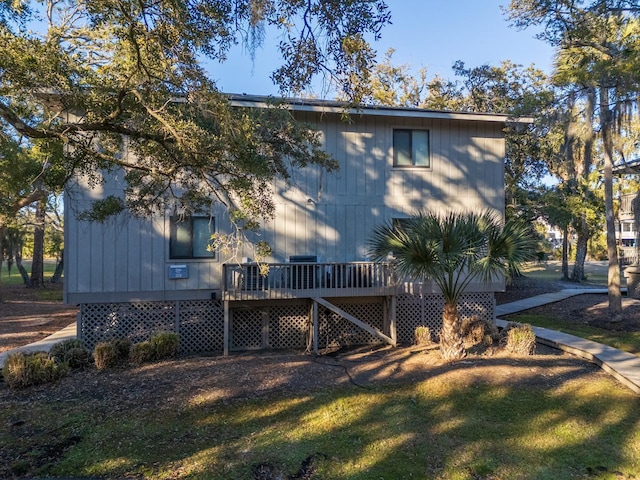 exterior space featuring a wooden deck and a yard