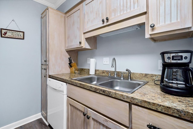 kitchen with sink, white dishwasher, dark wood-type flooring, light brown cabinets, and ornamental molding