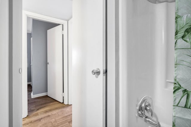 hallway with light wood-type flooring