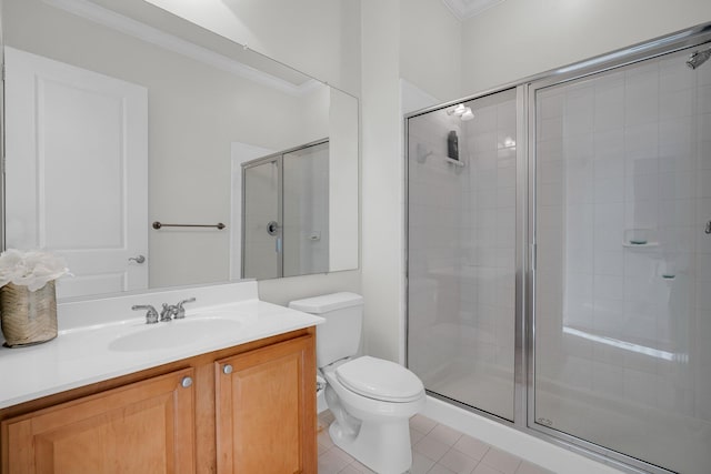 bathroom with toilet, an enclosed shower, crown molding, vanity, and tile patterned flooring