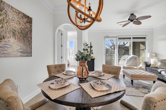 dining space featuring ceiling fan, ornamental molding, and hardwood / wood-style floors