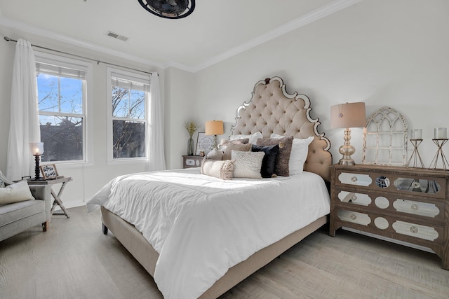 bedroom with crown molding and hardwood / wood-style flooring