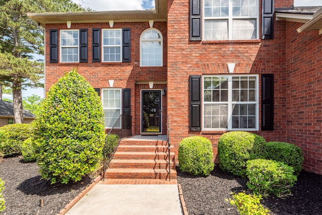 view of front of house with brick siding
