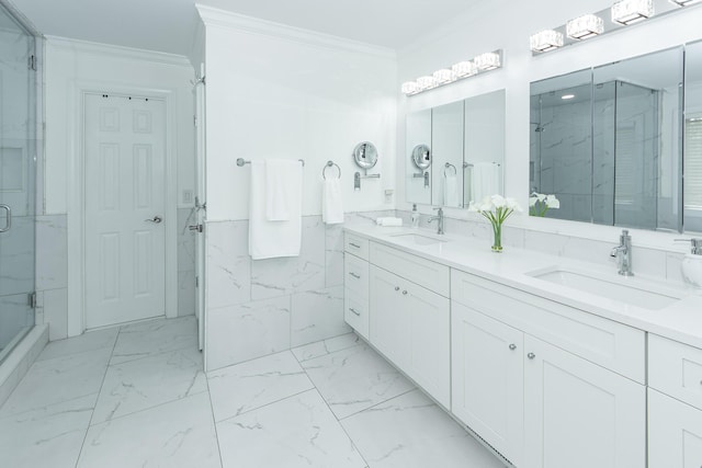 bathroom featuring a marble finish shower, marble finish floor, ornamental molding, and a sink