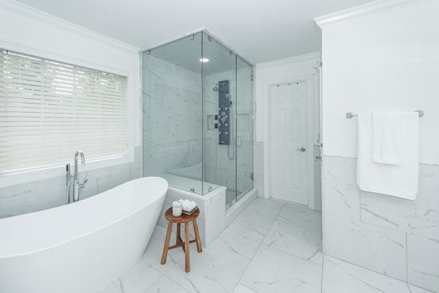 full bathroom with a freestanding tub, a marble finish shower, marble finish floor, and ornamental molding