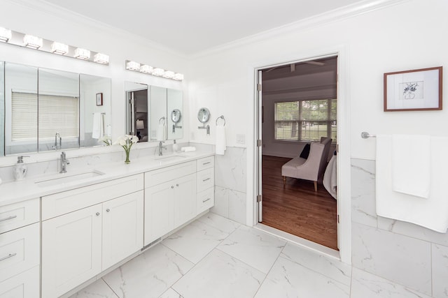 ensuite bathroom with ensuite bath, a sink, marble finish floor, and crown molding
