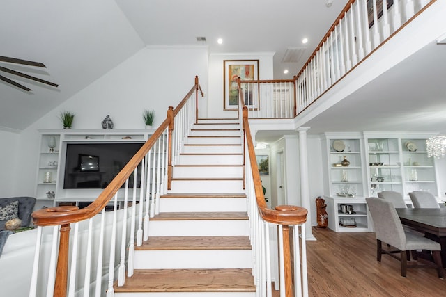 stairs featuring visible vents, wood finished floors, high vaulted ceiling, and recessed lighting