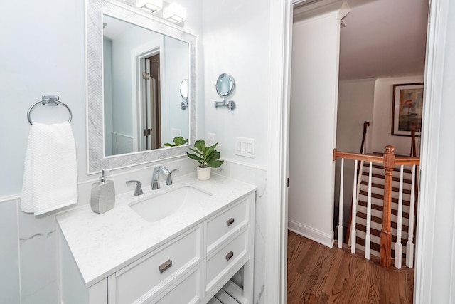 bathroom with vanity and wood finished floors